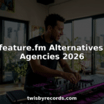 Music producer working at analog mixing console
