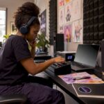 Woman mixing music in home studio setting