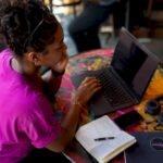 Marketer reviewing music landing page design
