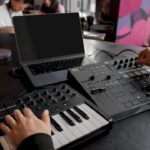Hands exporting stems in a home studio