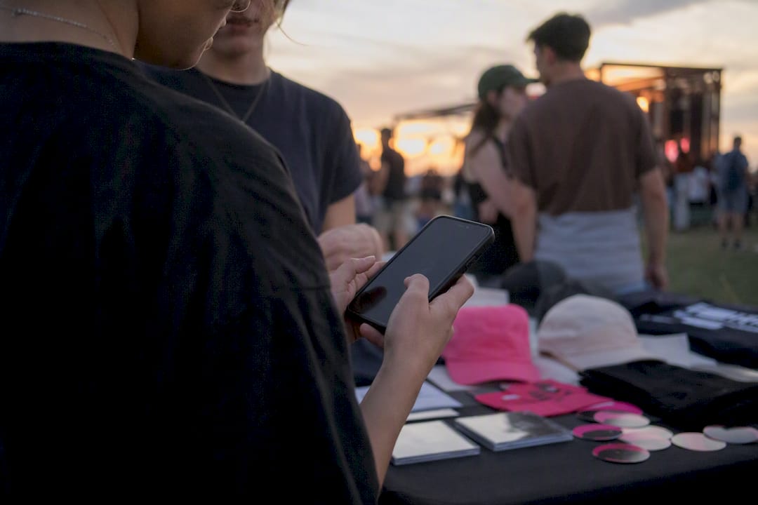 Merch table email signup at live show