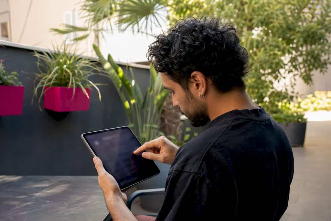 Hands correcting ISRC metadata on smartphone