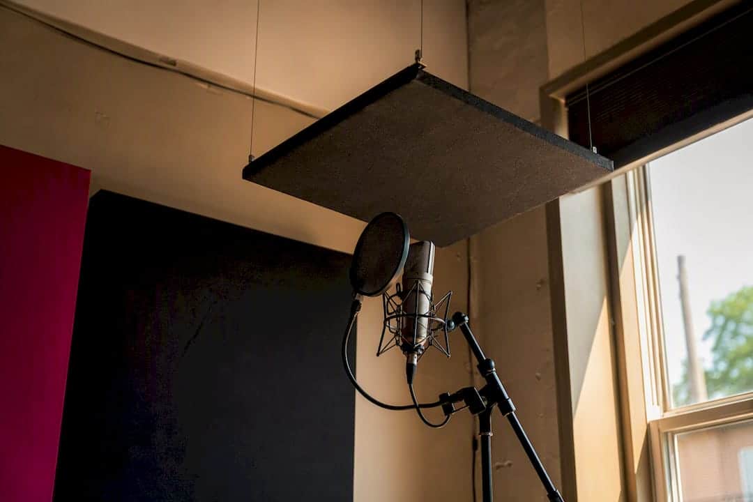 Acoustic ceiling cloud above microphone stand