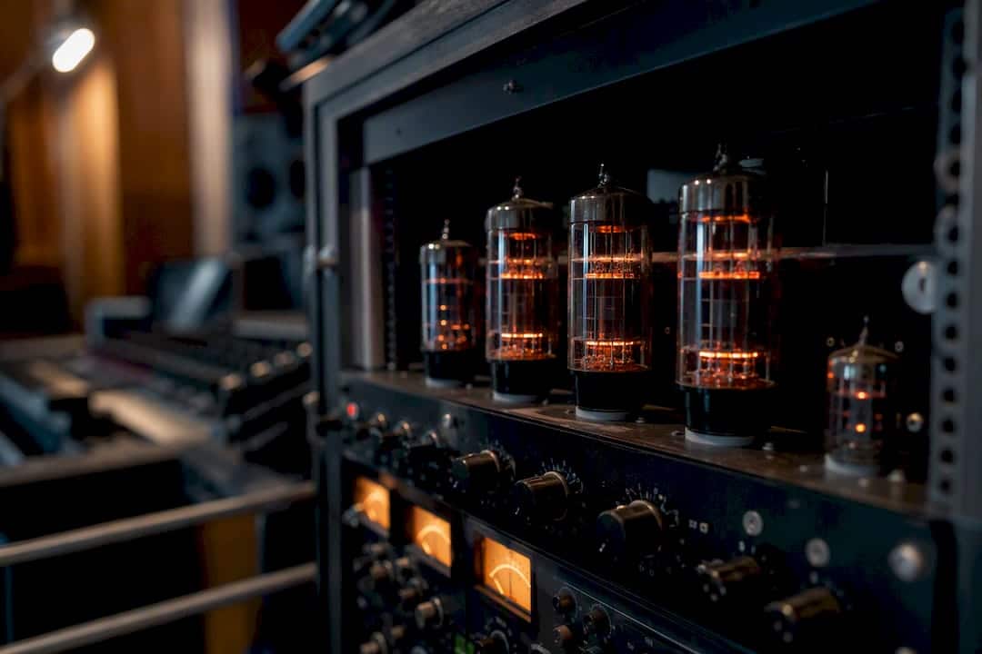 Glowing vacuum tubes in mastering studio close-up
