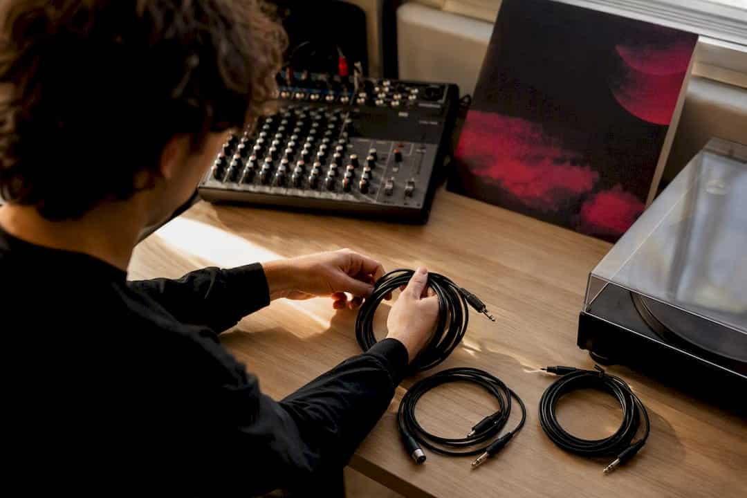 Hands preparing audio export on USB drive