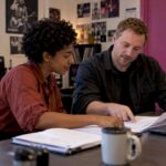 Musician and agent reviewing potential tour dates
