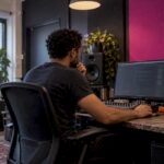 Engineer checking loudness in a mastering room