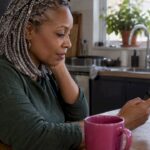 Musician reviewing streaming figures on her phone